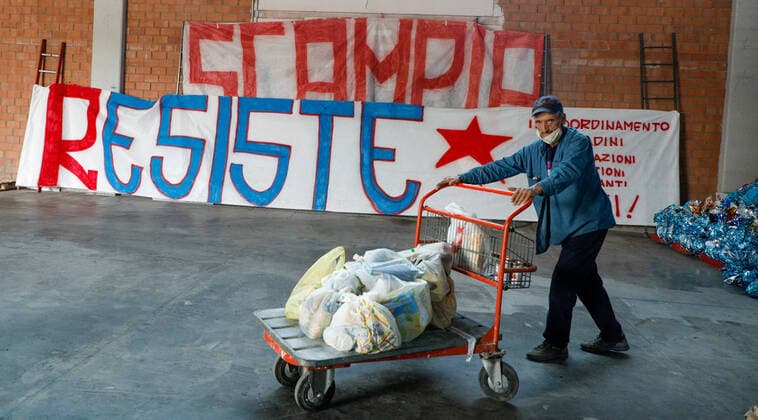 April 11, 2020, Naples, Campania, Italy: Italy, 11 04 2020, Naples, Scampia district, a group of associations from the northern area of the Neapolitan city with their volunteers, to face the poverty of families in the period of the quarantine for the pandemic for the covid-19 virus, go around the houses delivering basic necessities for Easter. Naples Italy - ZUMAs236 20200411_zap_s236_006 Copyright: xFabioxSassox