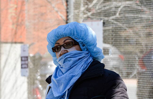 April 11, 2020, New York Bronx, USA: Nurse in front of hospital Lincoln Center Hospital. The Bronx heavily minority borough has the highest per-case fatality rate in NYC. The COVID-19 death toll in the NYC is 7,844 and 170,512 confirmed cases. 04 11 20. New York. New York Bronx. USA - ZUMAs252 20200411_znp_s252_003 Copyright: xMarcusxSantosx