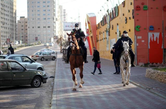 April 11, 2020, Gaza City, Gaza Strip, Palestinian Territory: Palestinian policemen stand guard on the streets as a preventive measure amid fears of the spread of the coronavirus disease (COVID-19), in Gaza city, on April 11, 2020 Gaza City Palestinian Territory - ZUMAap3_ 20200411_zaf_ap3_094 Copyright: xMahmoudxAjjourx