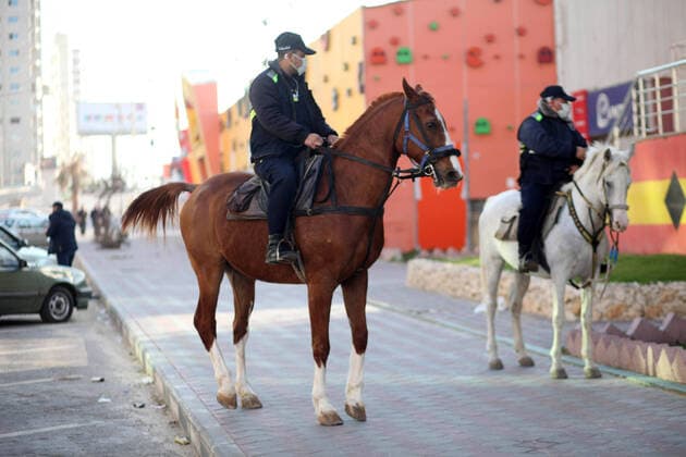April 11, 2020, Gaza City, Gaza Strip, Palestinian Territory: Palestinian policemen stand guard on the streets as a preventive measure amid fears of the spread of the coronavirus disease (COVID-19), in Gaza city, on April 11, 2020 Gaza City Palestinian Territory - ZUMAap3_ 20200411_zaf_ap3_098 Copyright: xMahmoudxAjjourx