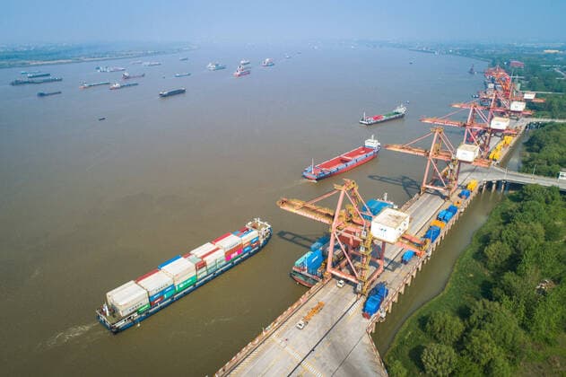 (200412) -- WUHAN, April 12, 2020 -- Photo taken on April 12, 2020 shows a view of the Yangluo Port in Wuhan, central China s Hubei Province. Wuhan, the megacity in central China, lifted outbound travel restrictions from April 8 after almost 11 weeks of lockdown to stem the spread of COVID-19. The cargos piled up at ports due to the COVID-19 pandemic have also been shipping away since the water ports in Wuhan resumed operation. ) CHINA-HUBEI-WUHAN-SHIPPING (CN) XiaoxYijiu 