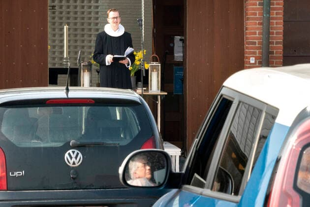 Pastor Isak Nolsoee holds church service in front of Roennevang Church on Sunday, April 12, 2020 Due to COVID 19, the Easter service becomes live-stream and can be experienced from the car in the square in front of the church photo Keld Navntoft Scanpix 2020, Taastrup,  Copyright: KeldxNavntoft KeldxNavntoftx COP101 spdk20200412-113521-L