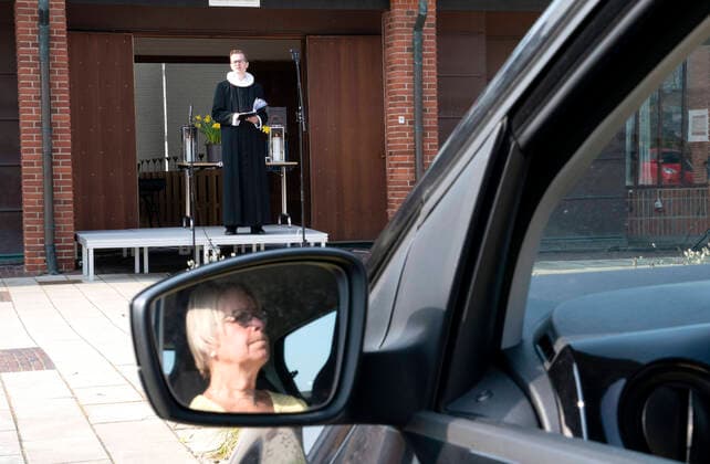 Pastor Isak Nolsoee holds church service in front of Roennevang Church on Sunday, April 12, 2020 Due to COVID 19, the Easter service becomes live-stream and can be experienced from the car in the square in front of the church photo Keld Navntoft Scanpix 2020, Taastrup,  Copyright: KeldxNavntoft KeldxNavntoftx COP101 spdk20200412-113613-L