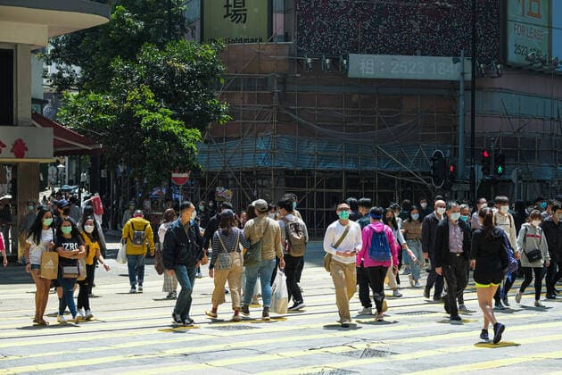 April 12, 2020, Hong Kong, China: People wear surgical face mask as they cross the street. Corona Virus (Covid19) cases in Hong Kong have reached over 1,000 on Saturday as authorities urged the public to stay at home during the long Easter weekend. Hong Kong China - ZUMAt141 20200412_zap_t141_007 Copyright: xKeithxTsujix