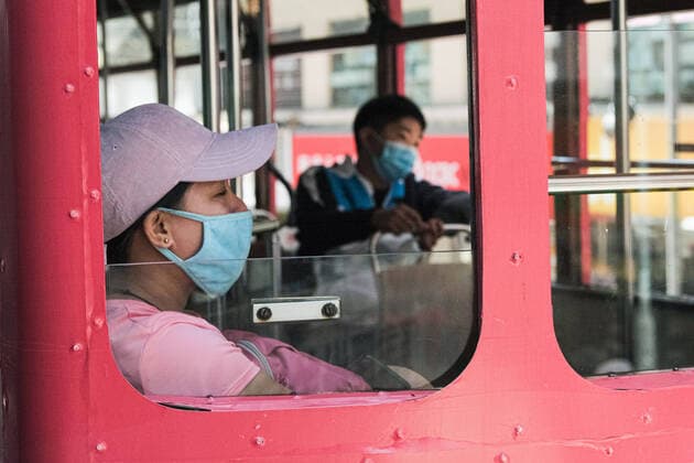 April 12, 2020, Hong Kong, China: People wear surgical face mask and commute on tram. Corona Virus (Covid19) cases in Hong Kong have reached over 1,000 on Saturday as authorities urged the public to stay at home during the long Easter weekend. Hong Kong China - ZUMAt141 20200412_zap_t141_010 Copyright: xKeithxTsujix