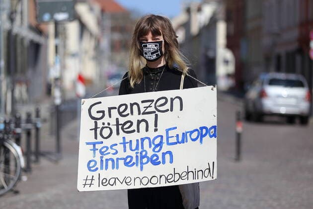 People form a human chain in Brandenburger Strasse and demand the evacuation of Greek refugee camps in view of the spread of the corona virus, Potsdam, 12 April 2020 Leave No One Behind Human chain in Potsdam