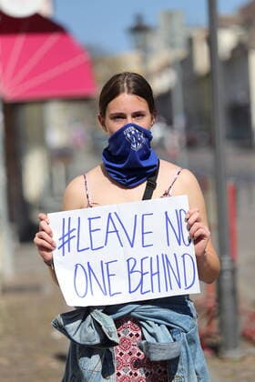 People form a human chain in Brandenburger Strasse and demand the evacuation of Greek refugee camps in view of the spread of the corona virus, Potsdam, 12 April 2020 Leave No One Behind Human chain in Potsdam