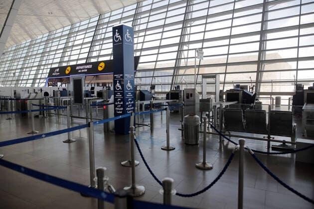 (200412) -- TEL AVIV, April 12, 2020 (Xinhua) -- Photo taken on April 12, 2020 shows the empty departure hall at Ben-Gurion International Airport near Israeli city of Tel Aviv amid the coronavirus pandemic. Israeli Prime Minister Benjamin Netanyahu ordered on Saturday to stop all flights to the country after passengers entered Israel without health supervision amid the novel coronavirus pandemic. According to the Israeli government s instructions, anyone who lands in the country must immediately enter a 14-day quarantine. (Photo by Gil Cohen Magen Xinhua) MIDEAST-TEL AVIV-COVID-19-FLIGHT STOP 