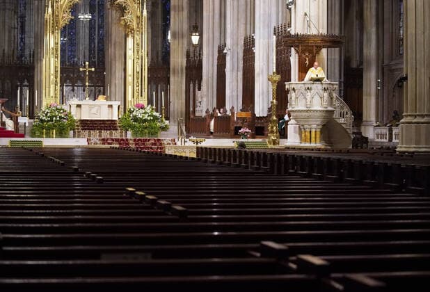 Church pews are empty of parishioners due to the Coronavirus pandemic while Cardinal Timothy Dolan offers Easter Sunday Mass at St. Patrick s Cathedral in New York City on Sunday, April 12, 2020. For the first time, the United States government and President Trump have declared all 50 states a major disaster for the same event.  NYP20200412107 JOHNxANGELILLO