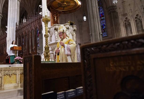 Church pews are empty of parishioners due to the Coronavirus pandemic while Cardinal Timothy Dolan offers Easter Sunday Mass at St. Patrick s Cathedral in New York City on Sunday, April 12, 2020. For the first time, the United States government and President Trump have declared all 50 states a major disaster for the same event.  NYP20200412112 JOHNxANGELILLO