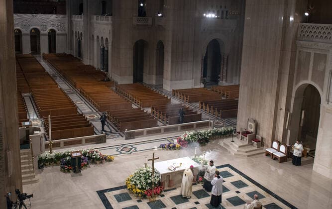 Archbishop of Washington Wilton Daniel Gregory (C) holds Easter mass to a virtual congregation at the Basilica of the National Shrine of the Immaculate Conception, in Washington, DC, Sunday, April 12, 2020. The Archdiocese of Washington DC closed the Basilica to the public and live-streamed the mass due to the coronavirus COVID-19 pandemic.  WAP20200412309 KEVINxDIETSCH