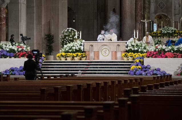 Archbishop of Washington Wilton Daniel Gregory (C) holds Easter mass to a virtual congregation at the Basilica of the National Shrine of the Immaculate Conception, in Washington, DC, Sunday, April 12, 2020. The Archdiocese of Washington DC closed the Basilica to the public and live-streamed the mass due to the coronavirus COVID-19 pandemic.  WAP20200412305 KEVINxDIETSCH
