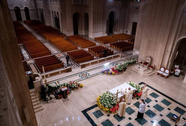 Archbishop of Washington Wilton Daniel Gregory (C) holds Easter mass to a virtual congregation at the Basilica of the National Shrine of the Immaculate Conception, in Washington, DC, Sunday, April 12, 2020. The Archdiocese of Washington DC closed the Basilica to the public and live-streamed the mass due to the coronavirus COVID-19 pandemic.  WAP20200412322 KEVINxDIETSCH