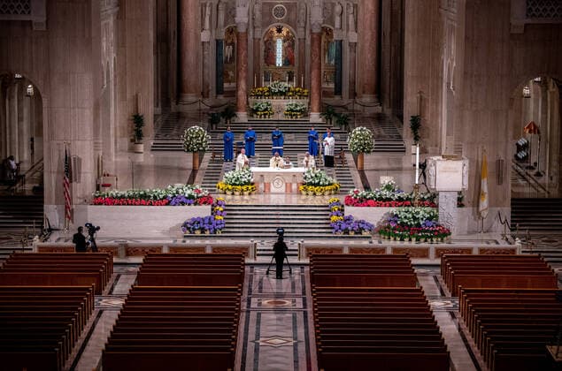 Archbishop of Washington Wilton Daniel Gregory (C) holds Easter mass to a virtual congregation at the Basilica of the National Shrine of the Immaculate Conception, in Washington, DC, Sunday, April 12, 2020. The Archdiocese of Washington DC closed the Basilica to the public and live-streamed the mass due to the coronavirus COVID-19 pandemic.  WAP20200412327 KEVINxDIETSCH