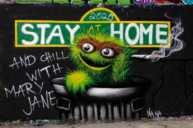 Duesseldorf, Germany, 12 04 2020 The graffiti mural on the outside wall of a warehouse in Duesseldorf Moersenbroich uses the slogan Stay at Home with the recommendation to relax there with a joint Chill with Mary Jane