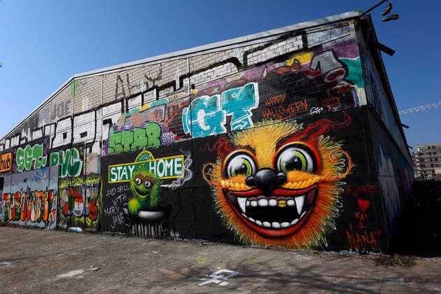 Duesseldorf, Germany, 12 04 2020 The graffiti mural on the outside wall of a warehouse in Duesseldorf Moersenbroich uses the slogan Stay at Home with the recommendation to relax there with a joint Chill with Mary Jane