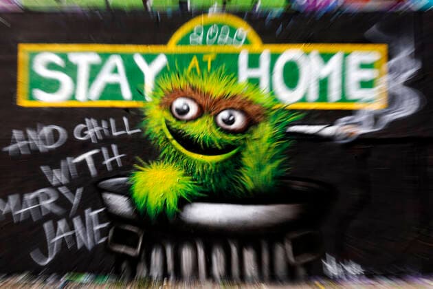 Duesseldorf, Germany, 12 04 2020 The graffiti mural on the outside wall of a warehouse in Duesseldorf Moersenbroich uses the slogan Stay at Home with the recommendation to relax there with a joint Chill with Mary Jane