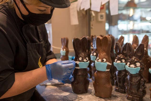 (200412) -- ATHENS, April 12, 2020 -- A pastry chef makes a mask for a chocolate Easter bunny in Athens, Greece, on April 12, 2020. ) GREECE-ATHENS-CHOCOLATE-EASTER BUNNY-MASK MariosxLolos 