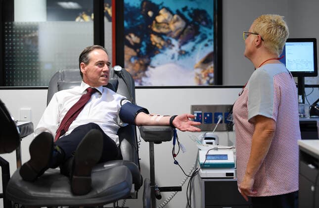 GREG HUNT CORONAVIRUS PRESSER, Australian Health Minister Greg Hunt (left) donates blood at the Lifeblood Donor Centre in Frankston, Melbourne, Monday, April 13, 2020. The Minister for Health, Greg Hunt has announced the Australian Government will provide a further $3 million to boost the nationally coordinated emergency response to the COVID-19 outbreak. ( NO ARCHIVING, EDITORIAL USE ONLY, NO USE IN BOOKS WITHOUT CONSENT MELBOURNE VIC AUSTRALIA  Copyright: xJAMESxROSSx 20200413001463264046