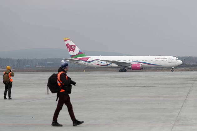 YEKATERINBURG, RUSSIA - APRIL 13, 2020: A Sunday Airlines plane carrying humanitarian aid arrives at Koltsovo International Airport. The first of the four humanitarian shipments to Russia s Ural Federal District, the charter flight from Shanghai has brought around $5m worth of medical supplies, such as non-reusable and high-level protection masks, face shields, protective goggles and suits, antiseptics and touch-free thermometers, over 10,6m items totaling more than 100t in weight. Equally divided between the Sverdlovsk and Chelyabinsk Regions, it will be sent to healthcare, budgetary, charitable institutions and volunteer organisations. Donat Sorokin TASS  TS0D57EB