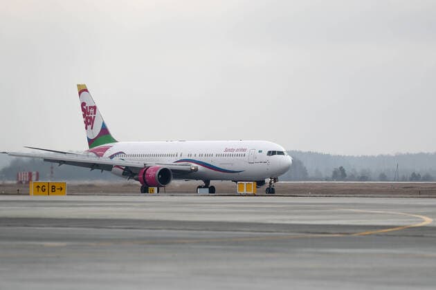 YEKATERINBURG, RUSSIA - APRIL 13, 2020: A Sunday Airlines plane carrying humanitarian aid makes a landing at Koltsovo International Airport. The first of the four humanitarian shipments to Russia s Ural Federal District, the charter flight from Shanghai has brought around $5m worth of medical supplies, such as non-reusable and high-level protection masks, face shields, protective goggles and suits, antiseptics and touch-free thermometers, over 10,6m items totaling more than 100t in weight. Equally divided between the Sverdlovsk and Chelyabinsk Regions, it will be sent to healthcare, budgetary, charitable institutions and volunteer organisations. Donat Sorokin TASS  TS0D57EE