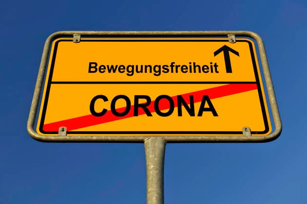 PHOTOMONAY, symbol picture, place-name sign, relaxation or end of curfew due to Corona Virus, Coronavirus, Sars CoV 2, Covid 19, Germany Coronavirus