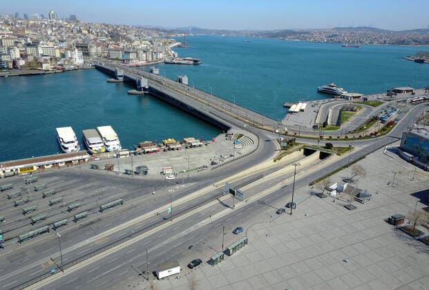 Normally busy but now mostly deserted Eminonu Square and Galata Bridge District at Historical Peninsula in Istanbul after the curfew declared by the government to slow coronavirus spread, Sunday, April 12, 2020. Copyright: TolgaxAdanali 16719039