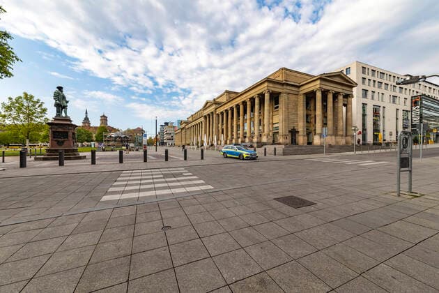 DEU, Germany, Baden Württemberg, Stuttgart, 13 04 2020 Shut down in Stuttgart The corona virus is paralysing the state capital streets and squares are deserted pedestrian zone Königstraße with Königsbau On the left the two towers of the Stiftskirche