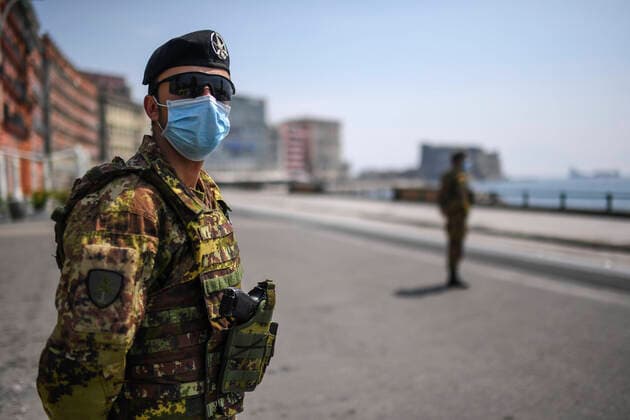 Italian Army soldiers at a checkpoint in Caracciolo street in central Naples. The Italian government has closed most stores to stop the spread of the COVID-19 coronavirus epidemic. Among other measures, the movements of people are allowed only for work, for the purchase of essential goods and for health reasons.  Copyright: xSalvatorexLaportax xIPAx xKontrolabx