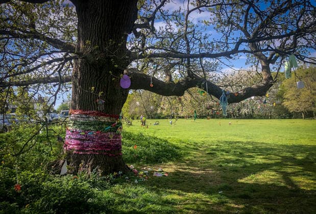 A tree is decorated by local residents in a village with positive messages and thank you to the NHS during Easter bank holiday Monday during the Covid-19 Pandemic as the UK Government advice to maintain social distancing and minimise time outside in High Wycombe on 13 April 2020. Copyright: xAndyxRowlandx PMI-3461-0020