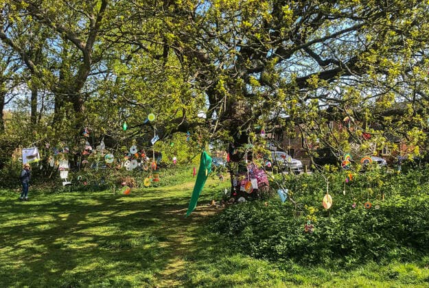 A tree is decorated by local residents in a village with positive messages and thank you to the NHS during Easter bank holiday Monday during the Covid-19 Pandemic as the UK Government advice to maintain social distancing and minimise time outside in High Wycombe on 13 April 2020. Copyright: xAndyxRowlandx PMI-3461-0009