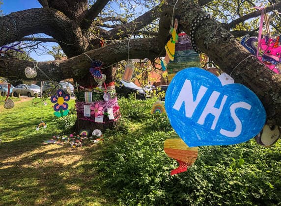 A tree is decorated by local residents in a village with positive messages and thank you to the NHS during Easter bank holiday Monday during the Covid-19 Pandemic as the UK Government advice to maintain social distancing and minimise time outside in High Wycombe on 13 April 2020. Copyright: xAndyxRowlandx PMI-3461-0013