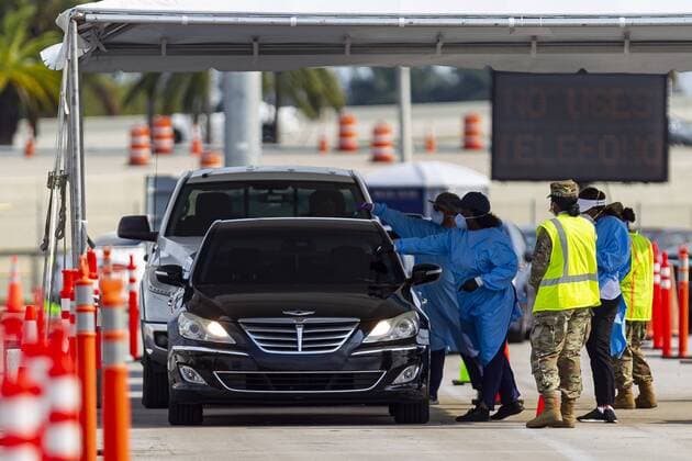 April 13, 2020, Miami, Fl, USA: A COVID-19 drive-thru testing center operates in a parking lot near the Hard Rock Stadium in Miami Gardens, Florida on Monday, April 13, 2020. The Florida Army National Guard set up the center and is now expanding its testing criteria to include anyone with COVID-19 symptoms. Miami USA - ZUMAm67_ 20200413_zaf_m67_013 Copyright: xMatiasxJ.xOcnerx
