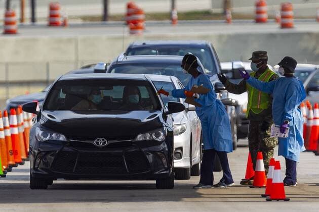 April 13, 2020, Miami, Fl, USA: A COVID-19 drive-thru testing center operates in a parking lot near the Hard Rock Stadium in Miami Gardens, Florida on Monday, April 13, 2020. The Florida Army National Guard set up the center and is now expanding its testing criteria to include anyone with COVID-19 symptoms. Miami USA - ZUMAm67_ 20200413_zaf_m67_016 Copyright: xMatiasxJ.xOcnerx