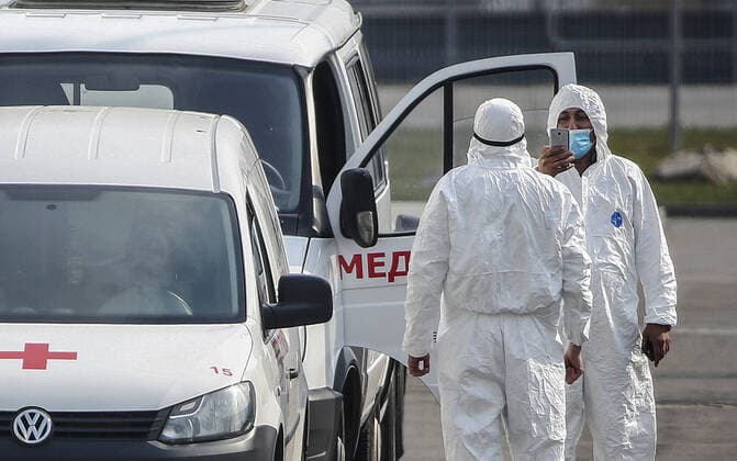 MOSCOW, RUSSIA - APRIL 13, 2020: Ambulance crew members in protective suits are seen at the Novomoskovsky multipurpose medical centre in Novomoskovsky Administrative District of Moscow, where patients with confirmed or suspected novel coronavirus infection (COVID-19) are being treated. As of 13 April 2020, Russia has reported more 18,300 confirmed cases of the novel coronavirus infection, with more than 11,500 confirmed cases in Moscow. Valery Sharifulin TASS  TS0D594D