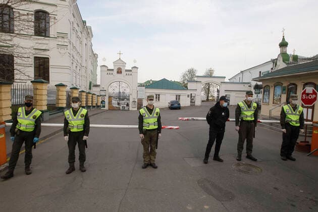 April 13, 2020, Kiev, Ukraine: National guard soldiers wearing face masks against coronavirus Covid-19 block the entrance to the Kyiv Pechersk Lavra in Kiev, Ukraine, on 13 April 2020. In total over 90 cases of the COVID-19 coronavirus have been confirmed at the Kyiv Pechersk Lavra, of which 63 were confirmed in the past 24 hours, at the historical and religious Orthodox Christian monastery, and its the largest outbreak of the novel coronavirus in the Ukrainian capital, according to media. Kiev Ukraine - ZUMAg194 20200413_zap_g194_009 Copyright: xSergxGlovnyx