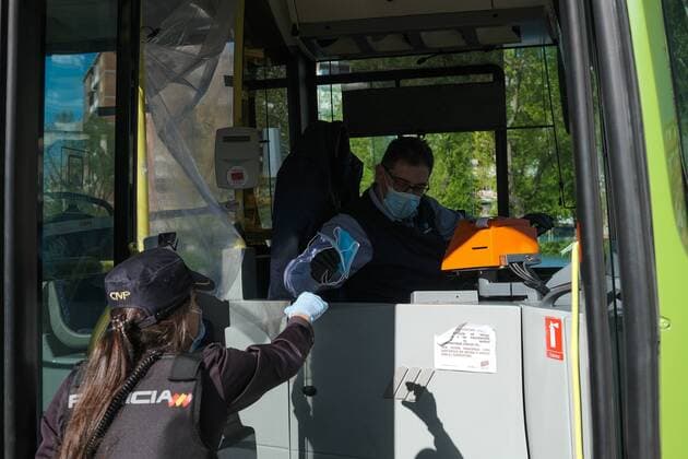 A police officer gives out free protective face masks during the lockdown amid the coronavirus disease COVID 19 outbreak in Madrid, Spain, April 13, 2020 Cordon Press