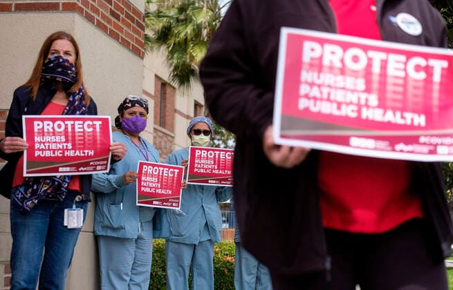 April 13, 2020, Los Angeles, California, U.S: Nurses and healthcare workers in a protest for the lack of personal protective equipment at UCLA Medical Center in Santa Monica, California, Monday April 13, 2020. Los Angeles U.S. - ZUMAc68_ 20200413_zaf_c68_005 Copyright: xRingoxChiux
