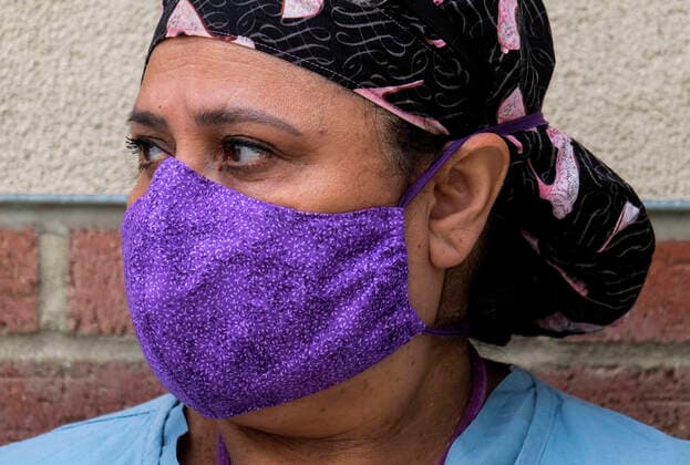 April 13, 2020, Los Angeles, California, U.S: A nurse joins other nurses and healthcare workers in a protest for the lack of personal protective equipment at UCLA Medical Center in Santa Monica, California, Monday April 13, 2020. Los Angeles U.S. - ZUMAc68_ 20200413_zaf_c68_006 Copyright: xRingoxChiux