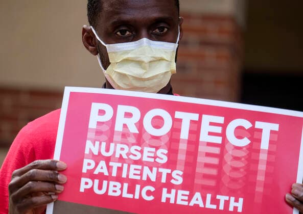 April 13, 2020, Los Angeles, California, U.S: A nurse joins other nurses and healthcare workers in a protest for the lack of personal protective equipment at UCLA Medical Center in Santa Monica, California, Monday April 13, 2020. Los Angeles U.S. - ZUMAc68_ 20200413_zaf_c68_020 Copyright: xRingoxChiux