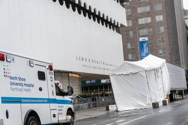 Live in NYC amid COVID-19 pandemic Refrigerated trailer used as mackshift morgue seen at Emergency entrance to Lenox Health Greenwich Village facility amid COVID-19 pandemic New York New York United States Copyright: LevxRadin