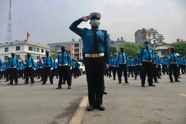 Nepal: Celebrating New Year 2077 B.S. They sang the national anthem with the flag of Nepal in their hands, lined up at the General Traffic Office during the celebration of Nepali New year 2077 B.S. Kathmandu Nepal Copyright: DipendraxDhungana