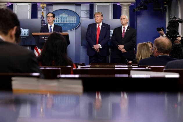 United States President Donald J. Trump reacts as he stands between US Secretary of the Treasury Steven T. Mnuchin and US Vice President Mike Pence at the Coronavirus Task Force press briefing at the White House in Washington on April 13, 2020. Copyright: xYurixGripasx xPoolxviaxCNPx MediaPunchx
