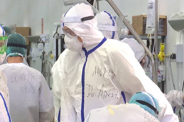LOMBARDY, ITALY â€“ APRIL 14, 2020: Staff members at work in a field hospital in Bergamo where Russian medics join their Italian counterparts in treating coronavirus patients, 31 of them already admitted for treatment, eight cured of the COVID-19 infection. Russian Defence Ministry TASS  TS0D59C1