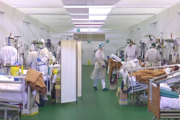 LOMBARDY, ITALY â€“ APRIL 14, 2020: Staff members at work in a field hospital in Bergamo where Russian medics join their Italian counterparts in treating coronavirus patients, 31 of them already admitted for treatment, eight cured of the COVID-19 infection. Russian Defence Ministry TASS  TS0D59B5