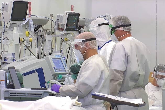 LOMBARDY, ITALY â€“ APRIL 14, 2020: A video screen grab shows staff members at work in a field hospital in Bergamo where Russian medics join their Italian counterparts in treating coronavirus patients, 31 of them already admitted, eight cured of the COVID-19 infection. Best quality available. Russian Defence Ministry TASS  TS0D59CA