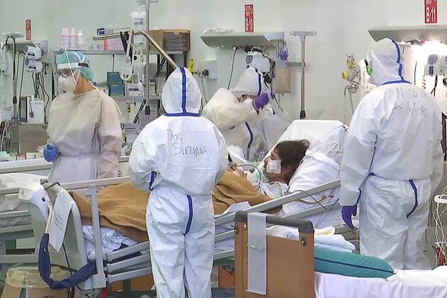 LOMBARDY, ITALY â€“ APRIL 14, 2020: A video screen grab shows staff members at work in a field hospital in Bergamo where Russian medics join their Italian counterparts in treating coronavirus patients, 31 of them already admitted, eight cured of the COVID-19 infection. Best quality available. Russian Defence Ministry TASS  TS0D59D2