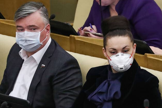 MOSCOW, RUSSIA - APRIL 14, 2020: Russian State Duma members wear face masks during a State Duma plenary meeting. Anton Novoderezhkin TASS  TS0D5A9C