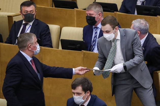 MOSCOW, RUSSIA - APRIL 14, 2020: Russian State Duma members wear face masks during a State Duma plenary meeting. Anton Novoderezhkin TASS  TS0D5A88