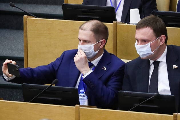 MOSCOW, RUSSIA - APRIL 14, 2020: Russian State Duma members wear face masks during a State Duma plenary meeting. Anton Novoderezhkin TASS  TS0D5A93